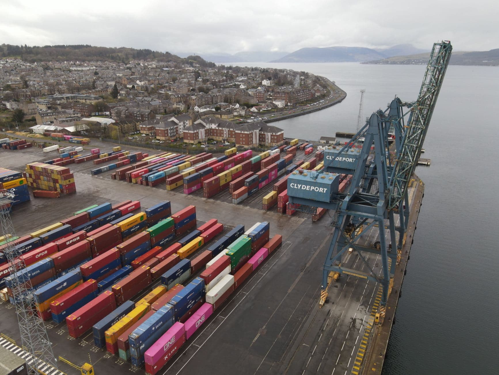 Aerial view of a freight container port with stacked shipping containers