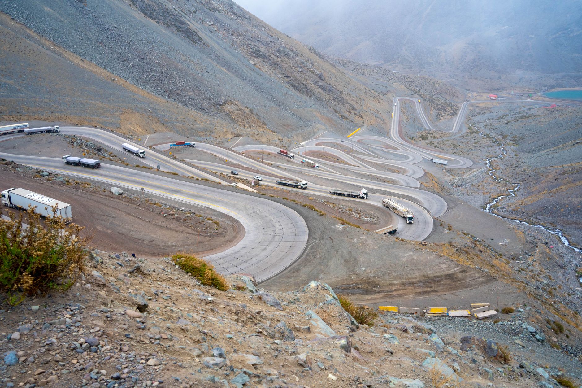 Aerial view of semi trucks driving on a wide American highway