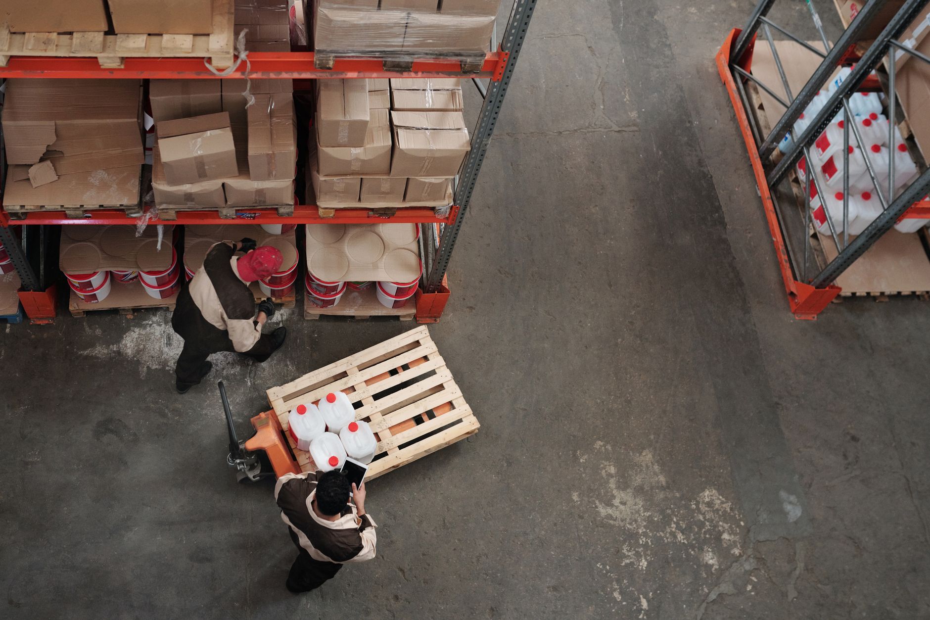 Workers at a warehouse loading dock preparing freight for dispatch