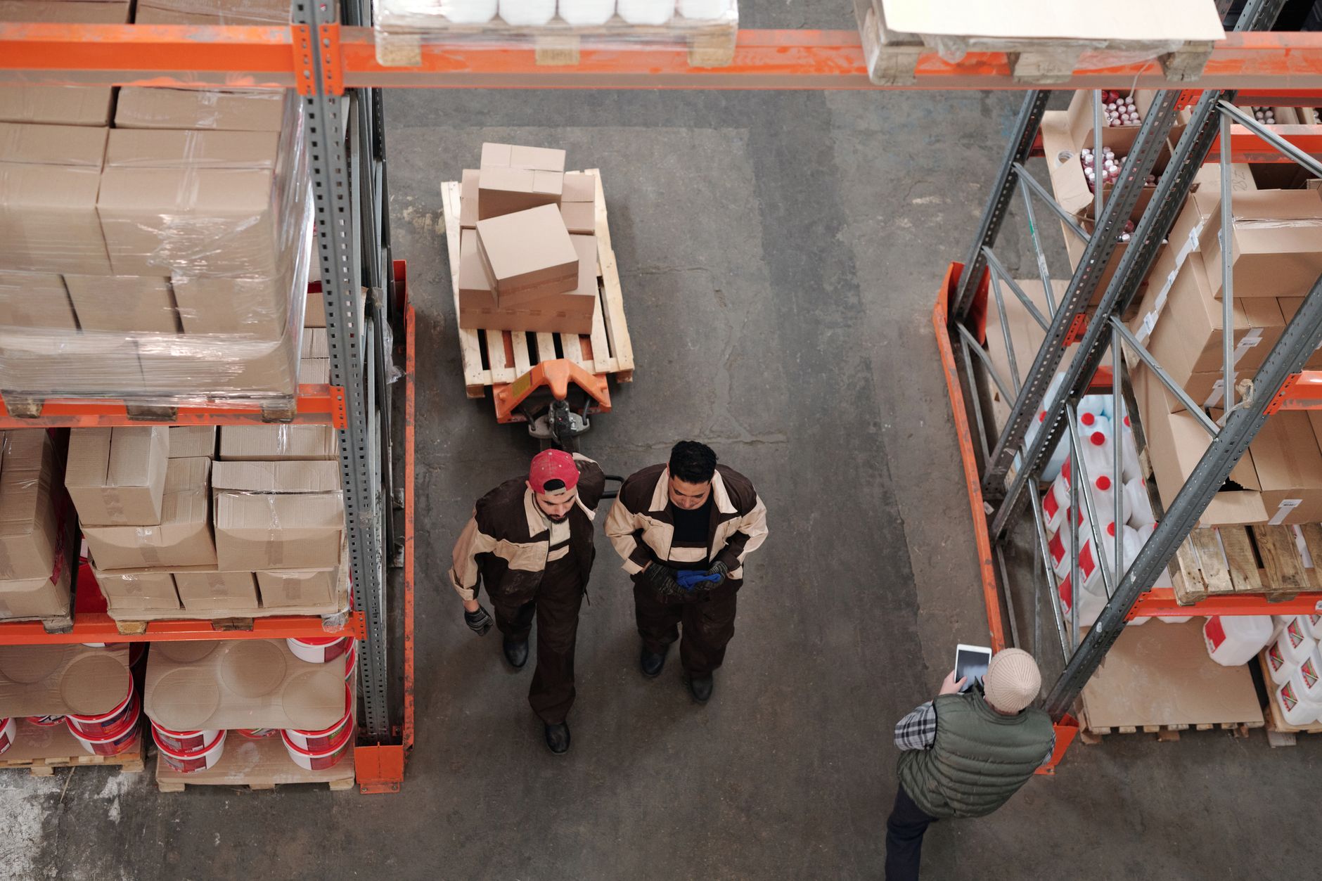 Logistics manager overseeing operations on a busy warehouse floor
